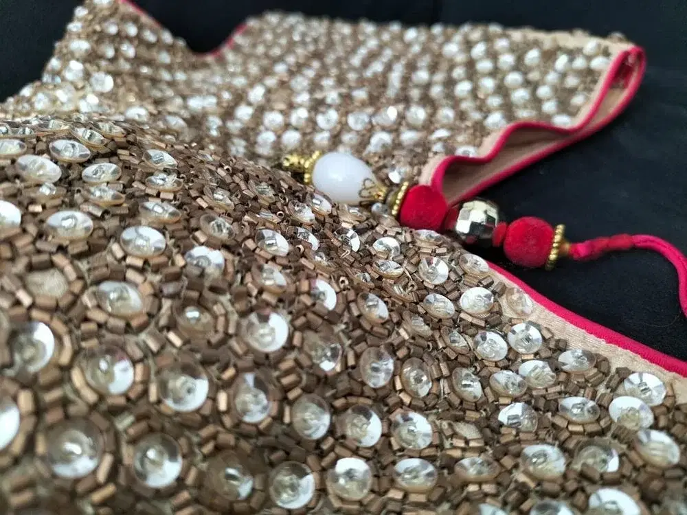 Fully Sequeens worked on the jacket with  copper, gold and red thread. stones are attached. Rich cotton, silk,  red colour Lahenga Dress. view 3