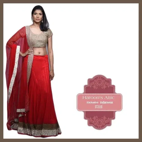 Fully Sequeens worked on the jacket with  copper, gold and red thread. stones are attached. Rich cotton, silk,  red colour Lahenga Dress.
