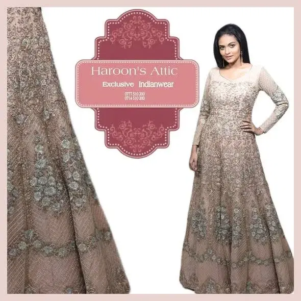 Fully Zardozi worked with  salmon pink gold and tea green thread. stones and mirrors attached. Raw silk salmon pink colour Anarkali Dress