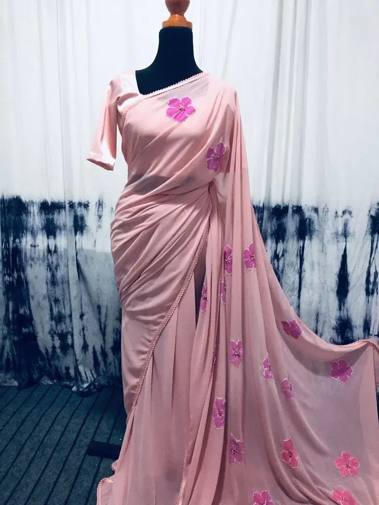 Embrace soft, romantic elegance with this stunning blush pink floral saree, designed for a flawless and graceful drape.